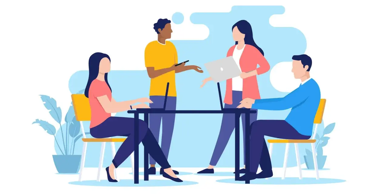 Équipe discutant autour d'une table, ordinateurs portables, plantes. Une scène de travail moderne, reflet de l'actualité droit social.