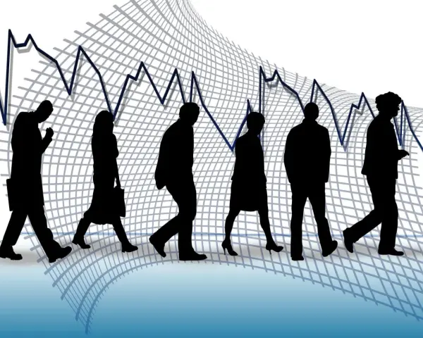 Silhouettes de personnes marchant sur un graphique boursier en baisse, symbolisant un licenciement pour suppression de poste.